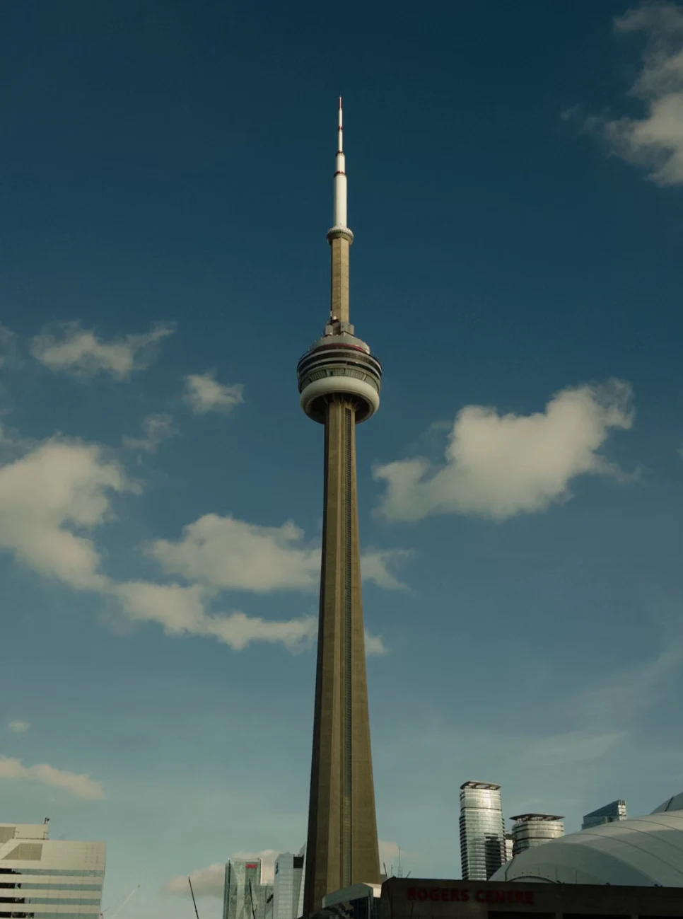 The CN Tower and Rogers Centre beneath a blue sky